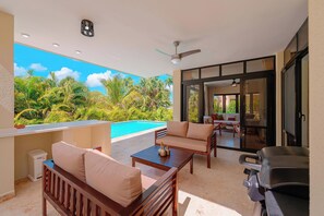 A balcony with a pool, outdoor furniture, and a grill. - 2 Bed, Encuentro Retreat, Casa Tranquila (sosua)