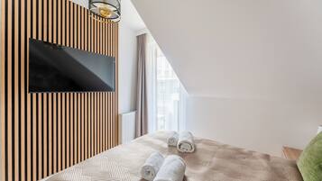 Premium bedding, laptop workspace, blackout curtains, iron/ironing board