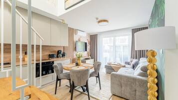 Premium Penthouse, 2 Bedrooms | Living area | 40-inch LED TV with cable channels