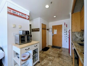 A kitchen with a microwave, toaster, and wooden cabinets. - New Listing | Updated | Walk to Slopes, Hot Tubs (Keystone)