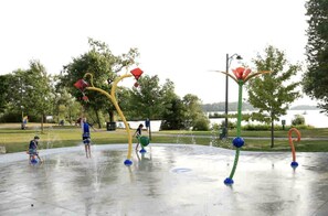 An outdoor water play area with multiple water jets and colorful structures. - Stunning Cottage with Fireplace in Lawartha Lakes, Ontario (Kawartha Lakes)