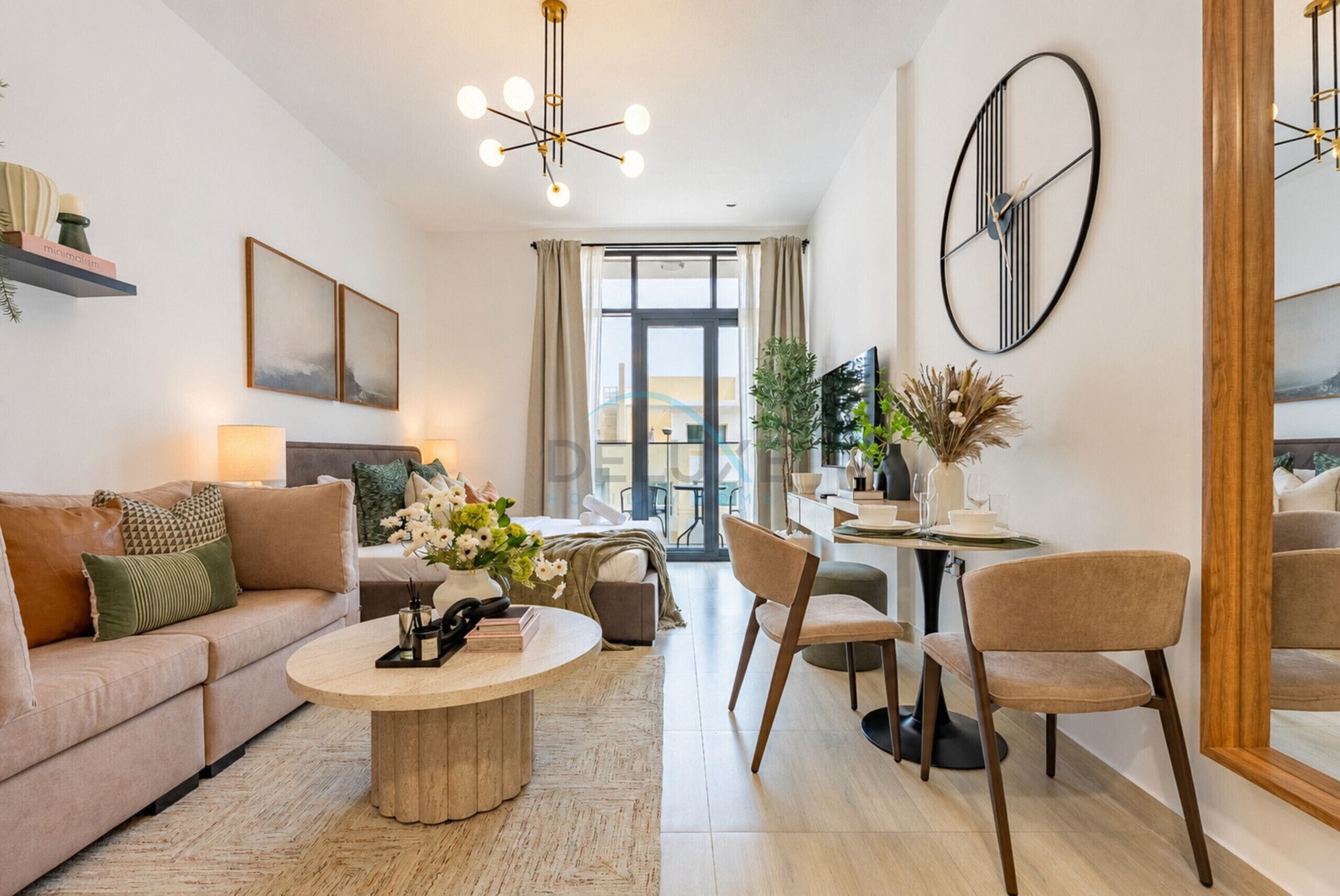 A modern living room with a sofa, coffee table, and dining area.