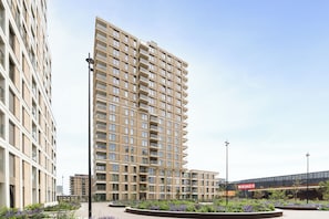 A modern high-rise building with a rectangular facade, multiple balconies, and a central entrance. - 2 bedroom accommodation in OOSTENDE (OOSTENDE)