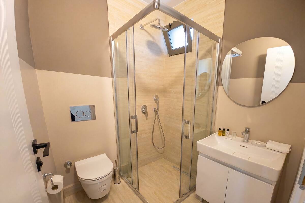 Shower, hair dryer, towels, soap
