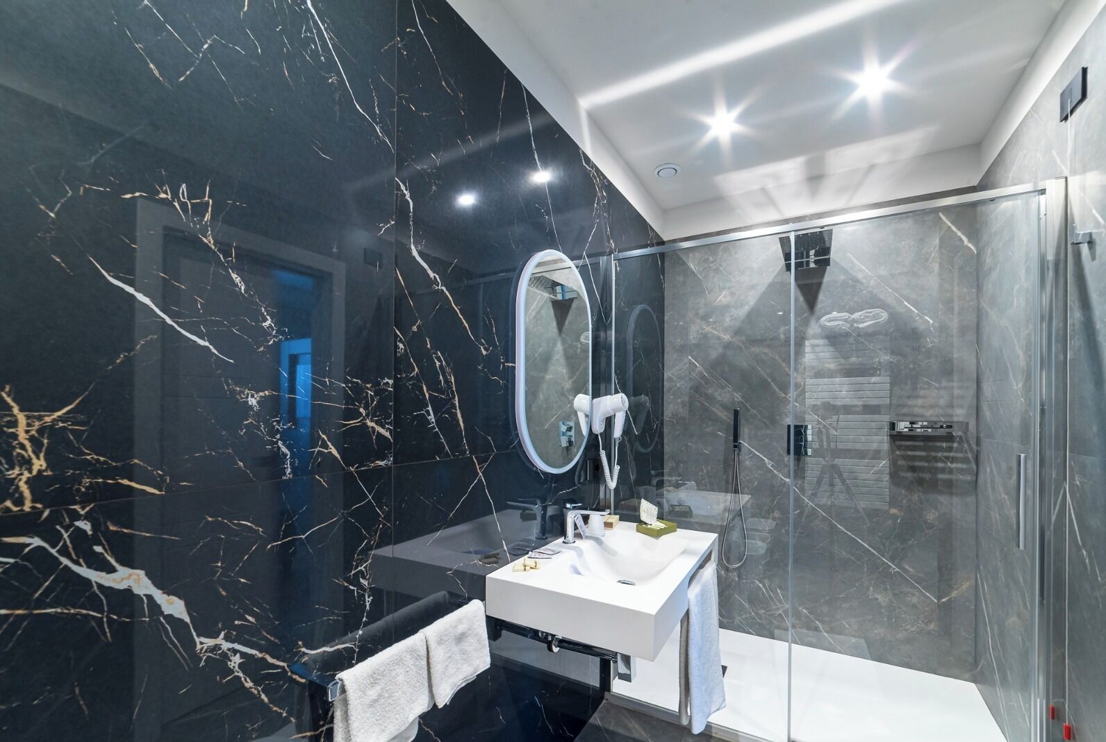 Shower, hair dryer, slippers, towels