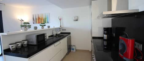 Coffee/tea maker, microwave, dishwasher, cookware/dishes/utensils