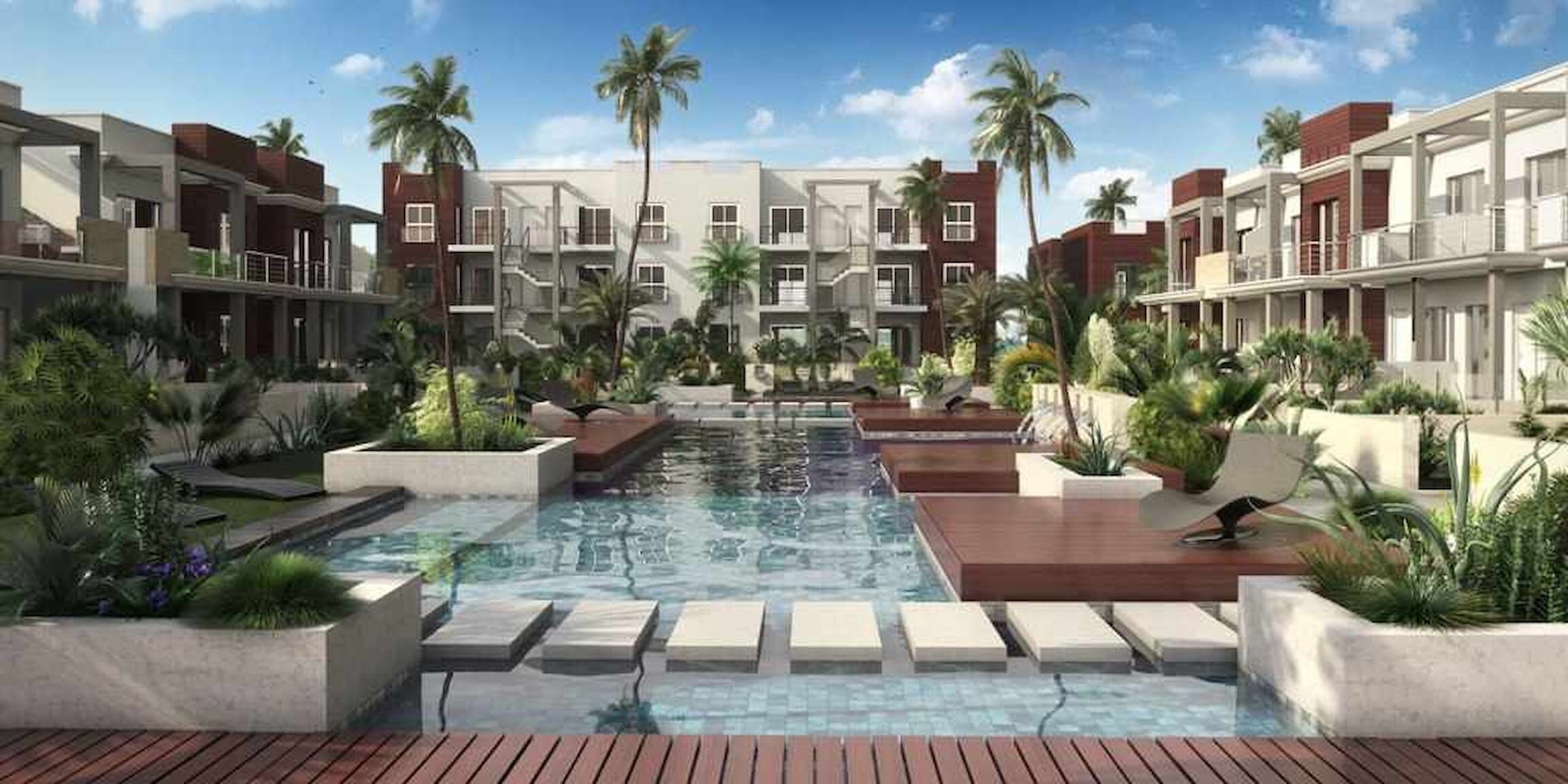 A modern hotel with a central pool, surrounded by lush greenery and palm trees.