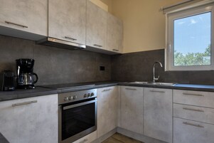 Deluxe Villa | Private kitchen | Espresso maker, electric kettle, toaster, eco-friendly cleaning products