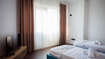 Desk, iron/ironing board, WiFi (free), bed sheets