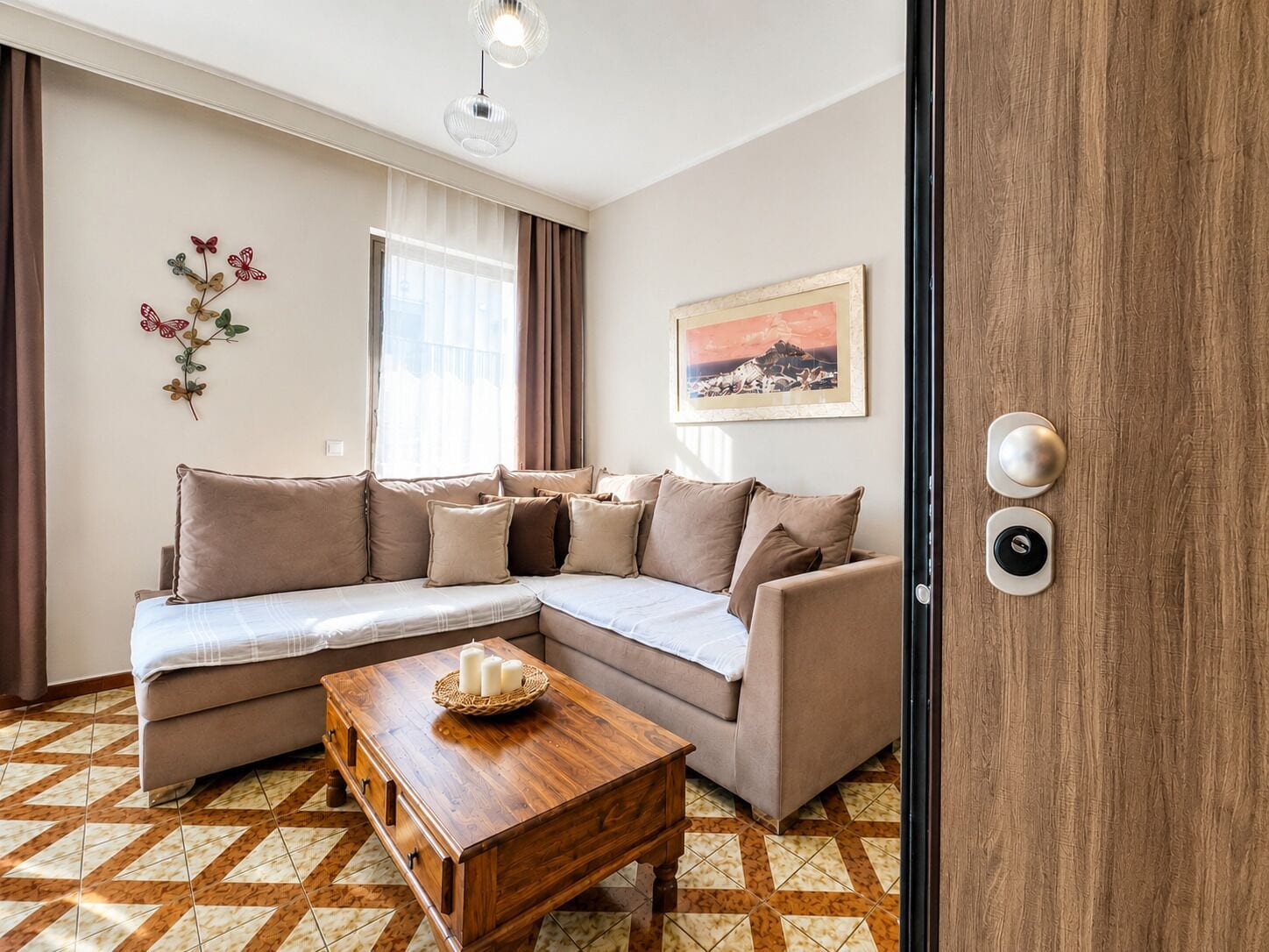 A modern living room with a sectional sofa, a wooden coffee table, a decorative wall piece, and a framed picture.