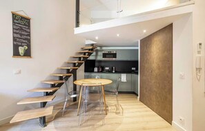 A modern kitchen with a built-in oven, microwave, and a coffee machine. - POSITIONED ON THE ICONIC PLACE GARIBALDI,IN THE MOST VIBRANT &HISTORIC SQUARES (Nice)