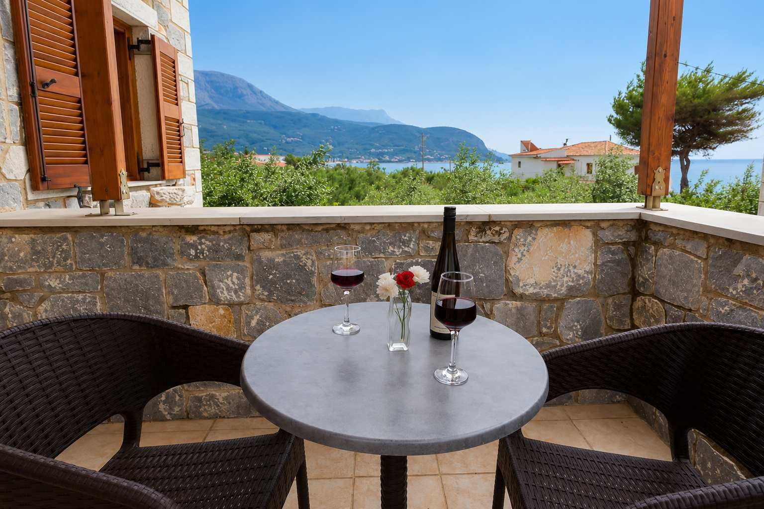 Relax outdoors on the furnished balcony surrounded by beautiful scenery.