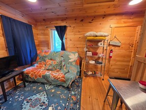 Living area - Round Lake Cabin. Escape to lake life close to amenities and attractions. (Charlotte)