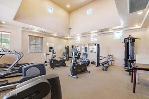 A spacious gym with treadmills, elliptical machines, and weight equipment. - Southern #1083 Mesa (Mesa)