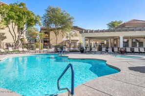 A swimming pool with lounge chairs and a covered seating area. - Southern #1083 Mesa (Mesa)