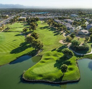 An aerial view of a golf course with multiple water hazards, surrounded by residential areas. - Captain Dreyfus Phoenix (Phoenix)