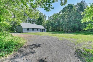 A single-story building with a gravel driveway leading to a grassy area. - Fish and Swim: Home w/ Catskill Creek Views! (East Durham)