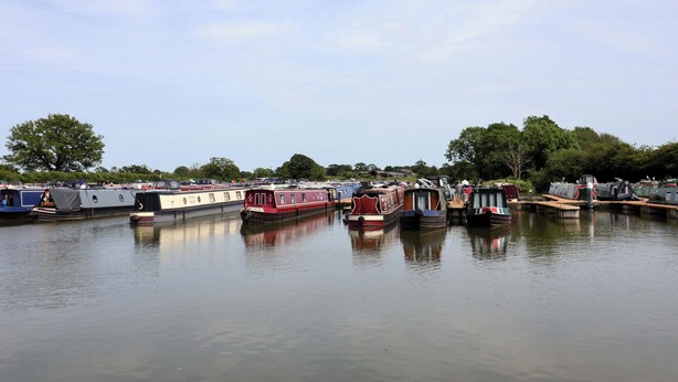 A calm waterway with several narrowboats docked. - Sid's Nest (Whitchurch)