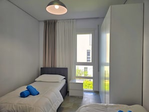 2 dormitorios, tabla de planchar con plancha, wifi gratis y ropa de cama