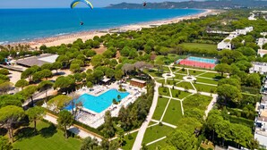 An aerial view of a resort with a swimming pool, tennis courts, and a beach. - Superb Villa With Pool in San Pietro Resort (Gjiri Lalzit)