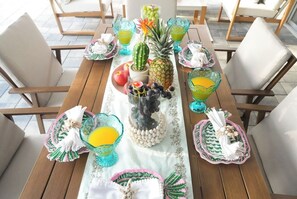 A dining table set with glassware, fruits, and decorative items. - Tampa High Roller, Relax and Play (Tampa)