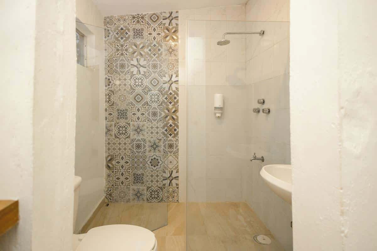 Shower, hair dryer, towels, shampoo