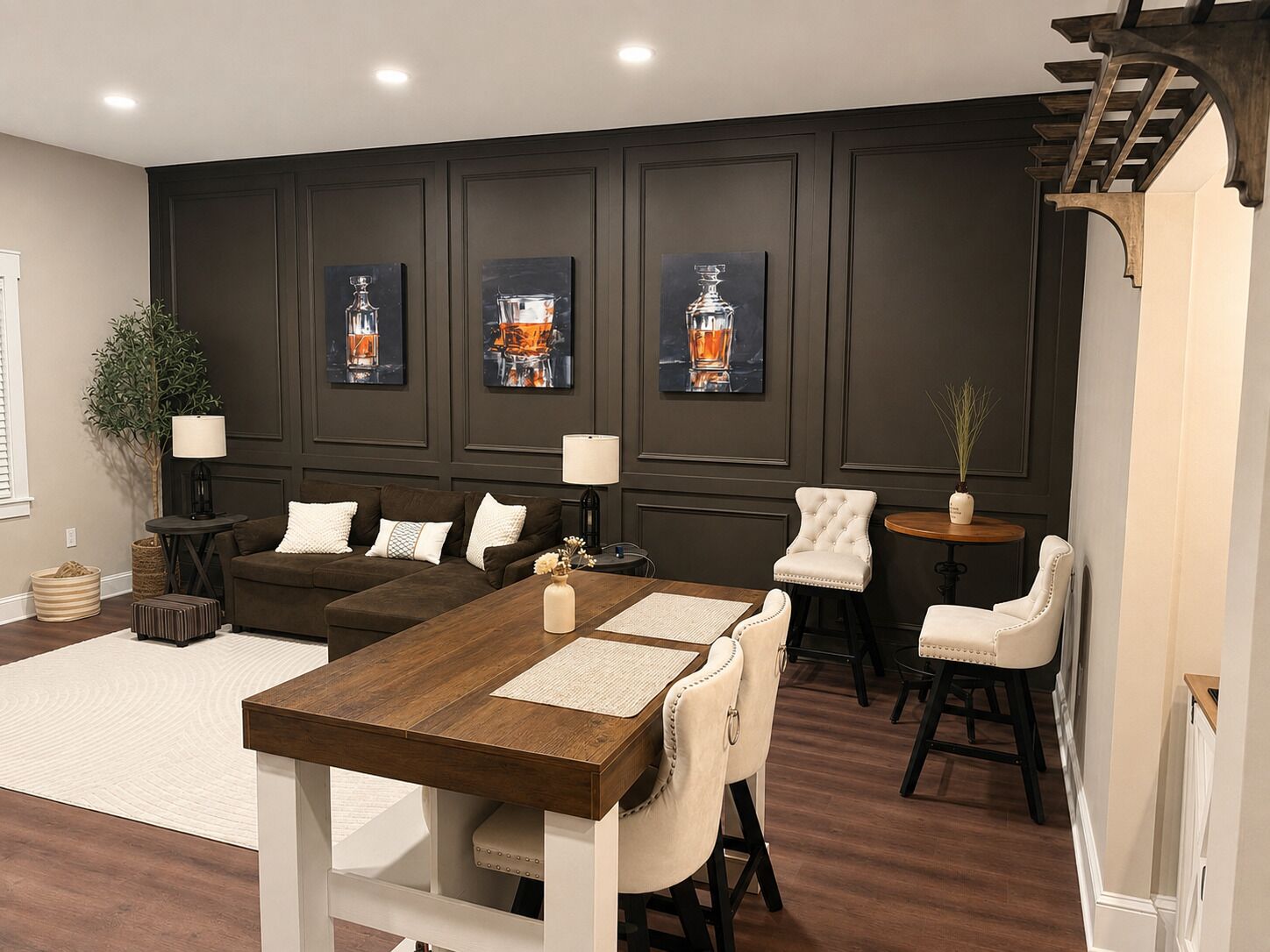 Spacious open-concept living area with café seating, sleeper sofa & island bar.