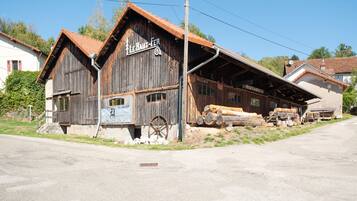 A rustic wooden building with a sign reading 'MUSEE du Bois'.