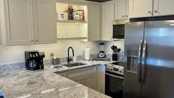 Coffee/tea maker, fridge, microwave, oven