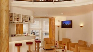 A modern interior with a bar area, seating, and a television. - 2 Person Holiday Park Home in Stade (Stade)