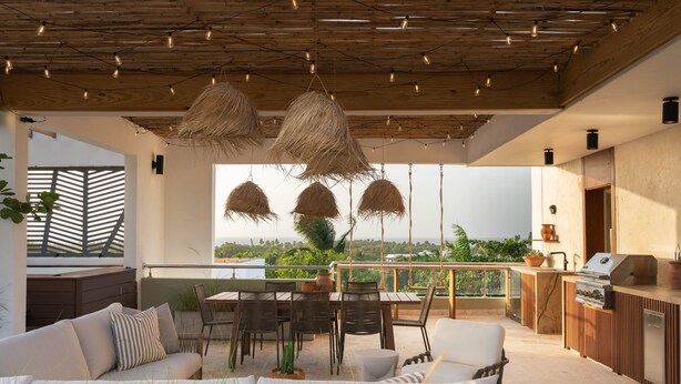 A spacious outdoor living area with a dining set, seating, and a view of the landscape. - Altamar — Rooftop Penthouse, Private Jacuzzi, Walk to Encuentro Beach, Sleeps 8 (playa encuentro- cabarete)