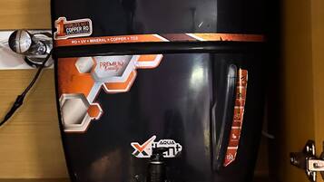A black water heater with orange accents and a 'World's No 1 Copper RO' label.