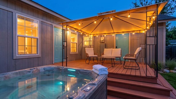A hot tub, outdoor seating, and a covered patio area. - Private 3BR Retreat in Arlington | Sleeps 8 (Arlington)