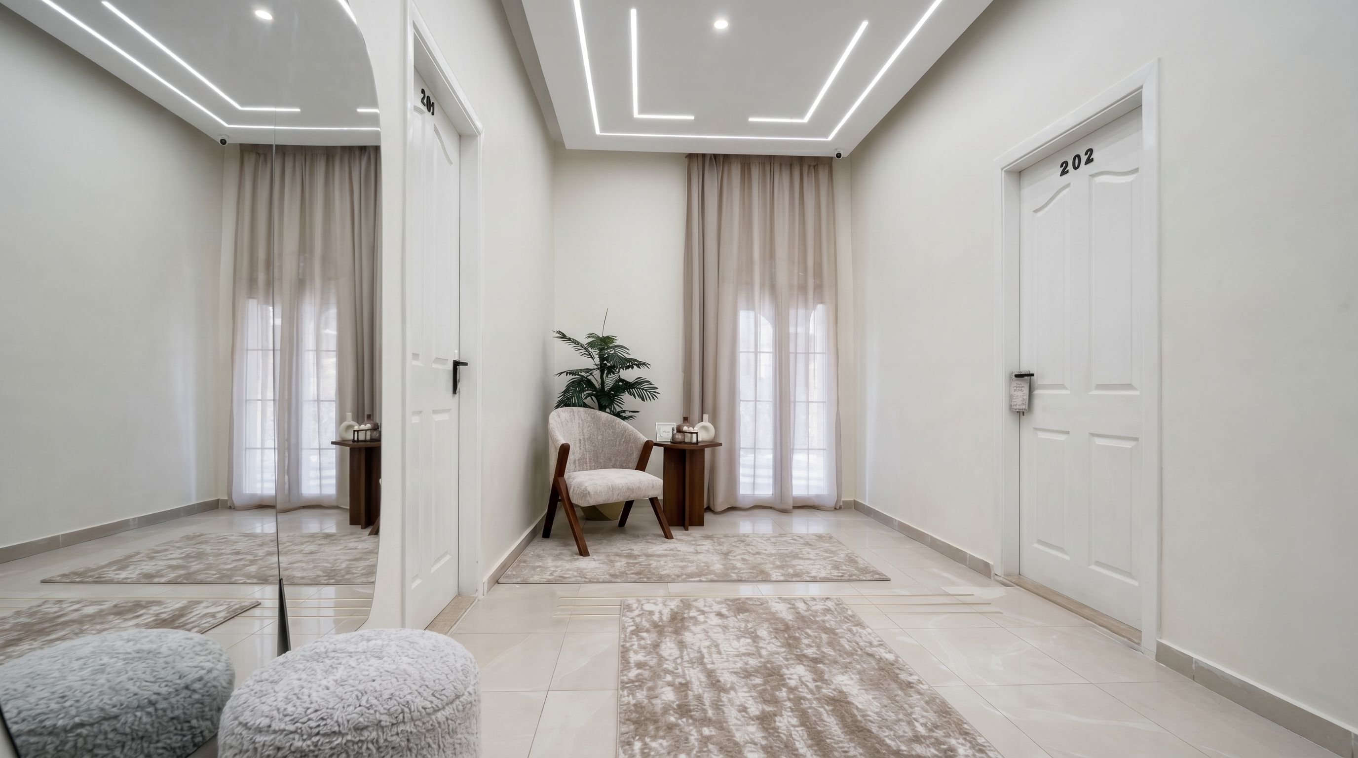 A modern room with a large mirror, a chair, a small table, and a door marked with the number 202.