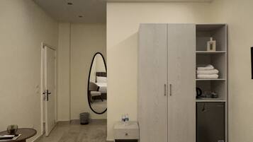A modern bedroom with a skylight, a wardrobe, a bedside table, and a bed.