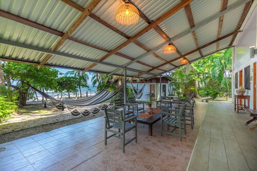 Open-air oceanfront home for 14 - steps to the sand in South Guiones, Nosara