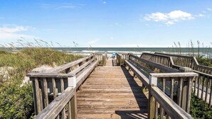 A wooden boardwalk leading to the beach with a clear view of the ocean. - High Tides & Pink Skies-3BR, Pool, Views, Linens, Steps to Beach - North Topsail (North Topsail Beach)