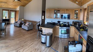 A spacious kitchen with wooden cabinets, a built-in oven, and a microwave. - Best View in Fairplay (Fairplay)