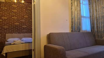 Familie suite | Een minibar, geluiddichte muren, een strijkplank/strijkijzer