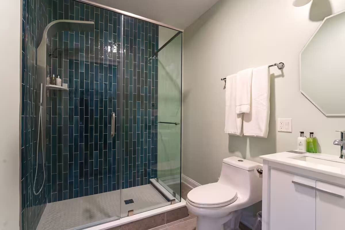 Shower, hair dryer, towels, shampoo