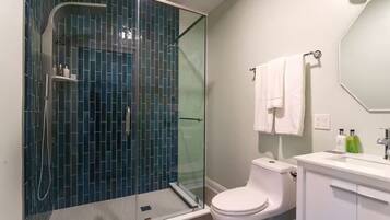 Shower, hair dryer, towels, shampoo