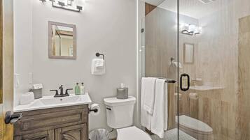 Shower, hair dryer, towels, shampoo