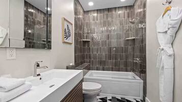 Shower, hair dryer, towels, shampoo