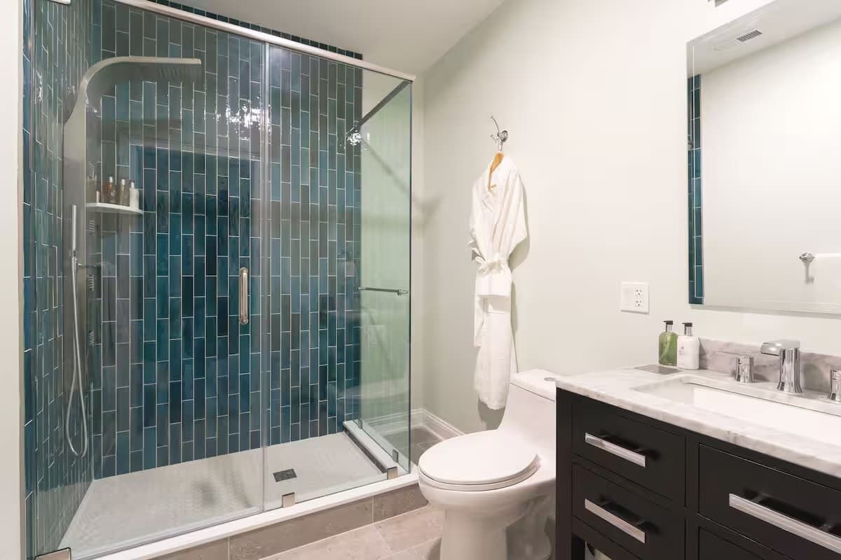Shower, hair dryer, towels, shampoo