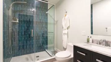 Shower, hair dryer, towels, shampoo