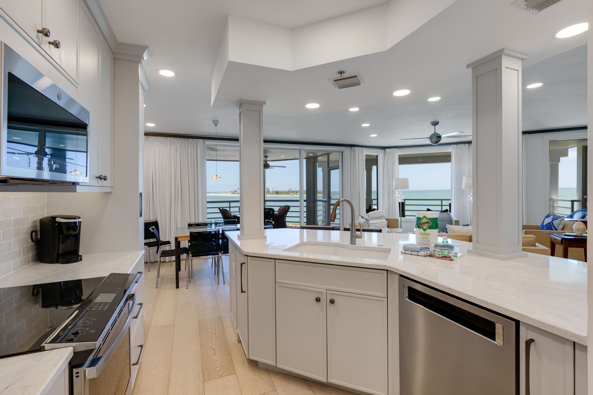A modern kitchen with a built-in oven, a coffee maker, and a dishwasher.
