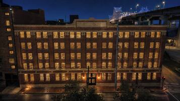 A multi-story building with a uniform facade, large windows, and a flat roof.