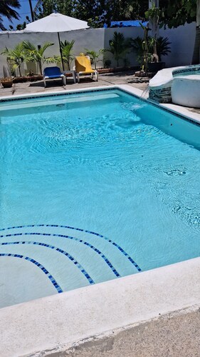 Air-conditioned house on a Caribbean beach with a pool and hot tub