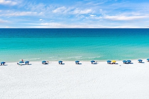 A beach with white sand and clear turquoise water. - Dunes of Crystal Beach 404 - Beachfront Condo with Community Pool in Destin (Destin)