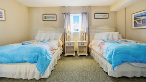 A hotel room with two beds, a window with curtains, and artwork on the walls. - Waterfront Condo | Harbourgate Marina Views (North Myrtle Beach)